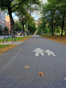Walking autumn street with icon on the ground in Tampere, Finland
