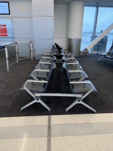 Row of empty airport chairs.