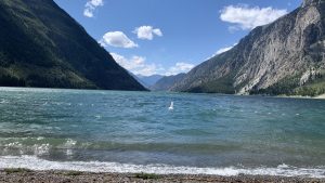 A perfect view of Mountains and clear sky from water level. 