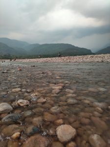 Crystal Clear Water and Stone View in Sada Pathor, Bholaganj, Sylhet with Majestic Mountains
