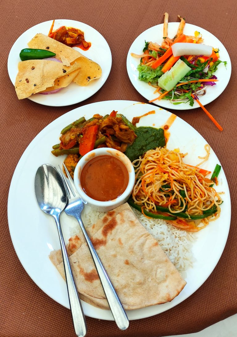 Lunch plate with rice, noodles, salad, etc. in ALICE Receptions, Kathmandu.