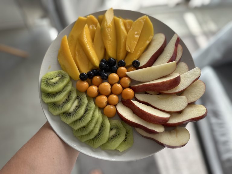 A full plates of fruits including Mango, Apple, Kiwi, Blueberry, Golden berry, Cartago, Costa Rica.