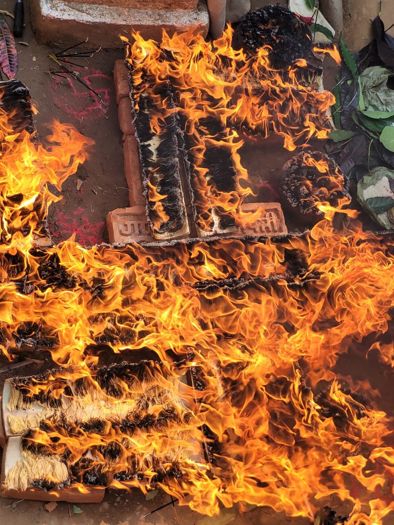 Festival of Light Pooja in Nepal, prayer light from open fire set on bricks