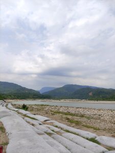 Scenic View of Sada Pathor, Bholaganj, Sylhet with Majestic Mountains and Serene River
