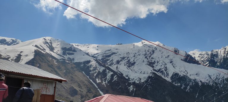 Snowflakes are kisses from heaven . A hill station view, mountains covered with the ice.