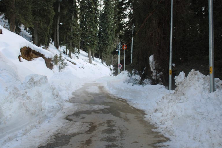 Snow all over the mountains and a walk way to the Himalayas.