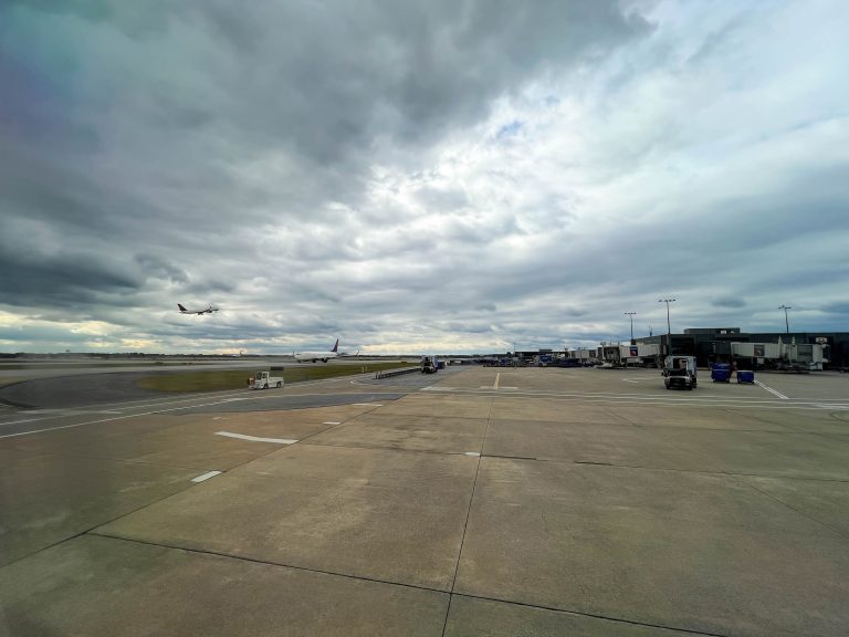 Airport tarmac with dark cloudy sky