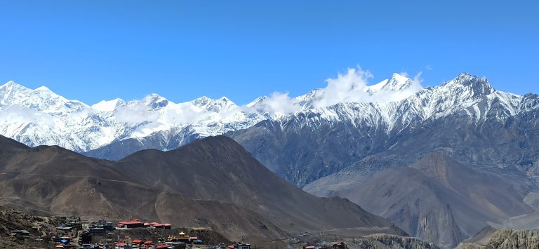 A view of Snow-capped mountains and hills of Nepal from a village.