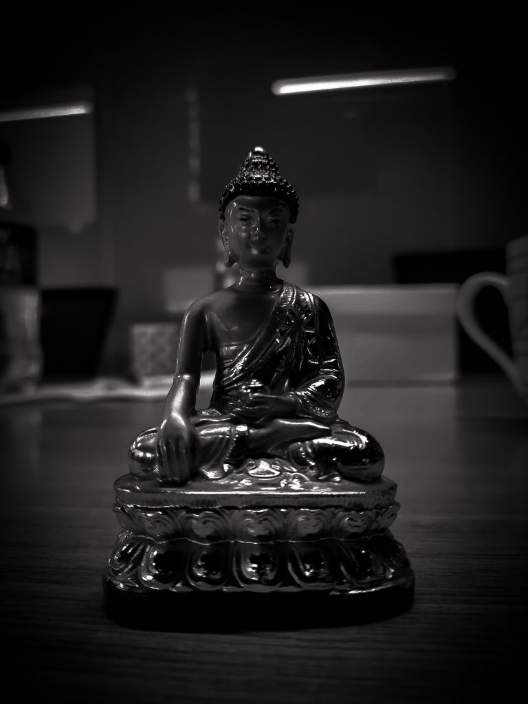 Small Buddha on a tabletop.