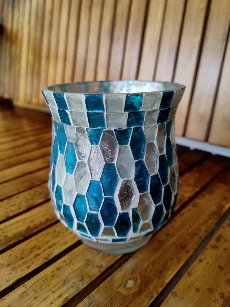 A mosaic candle holder