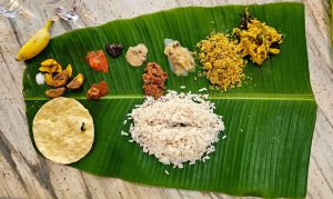 A traditional Kerala meal served on a banana leaf. 