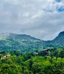 A view of green hills and cloudy sky in Kurisumala, Malappuram, Kerala, India