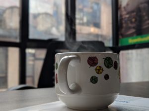 Cup with vapour of hot beverage 
