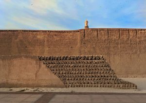 View of an old mud and brick wall in Dubai. 