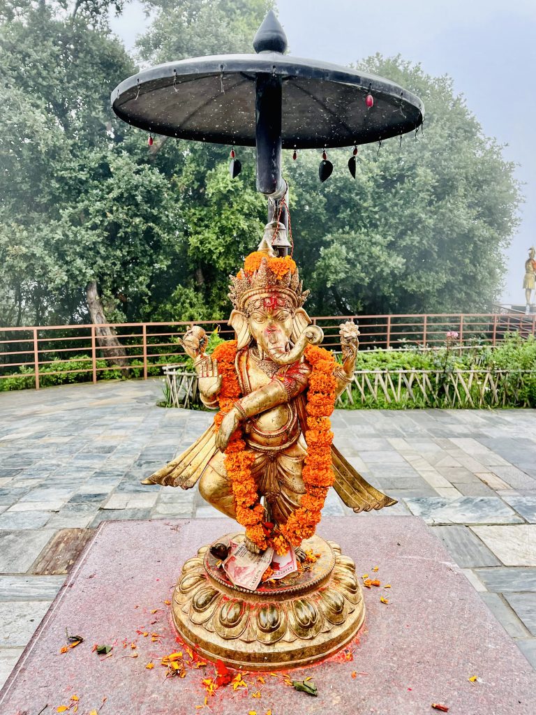 Lord Ganesh statue, on a foggy & rainy day. From Bagmati, Kathmandu, Nepal.