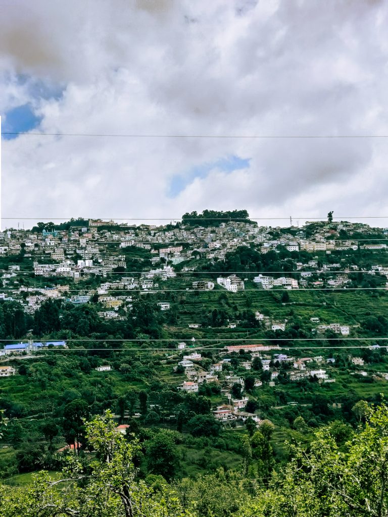 A view of Kodaikanal town where most of the buildings are white in color.