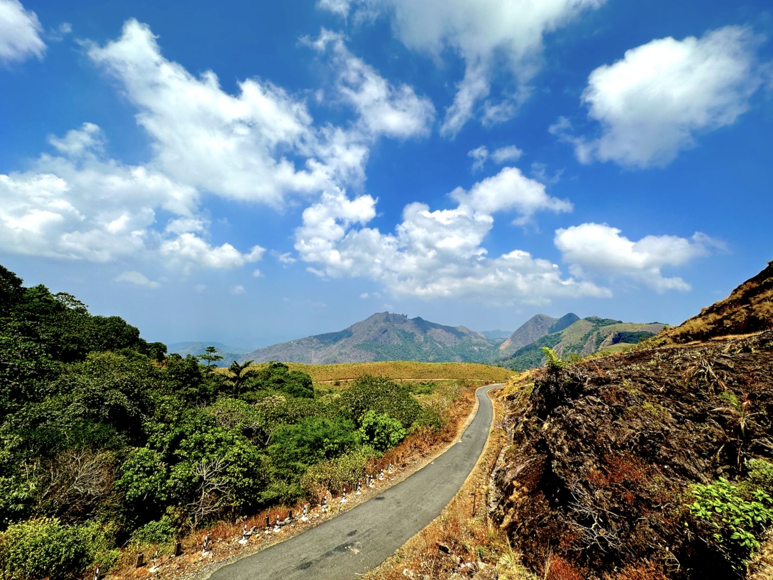 A beautiful road (Kanjar-Pullikkanam Road) through the forest to the Vagamon hill station in Kerala, India. It is a tourist destination in South India.