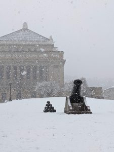 A cannon in front of Pittsburgh's Soldier's and Sailor's memorial, in the snow.