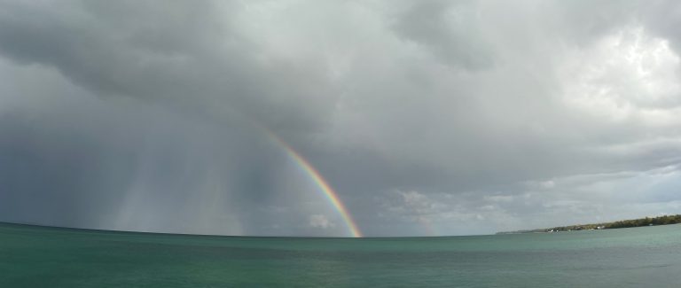 Rainbow in a storm over Lake Huron