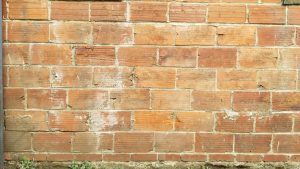 Close up view of a worn brick wall
