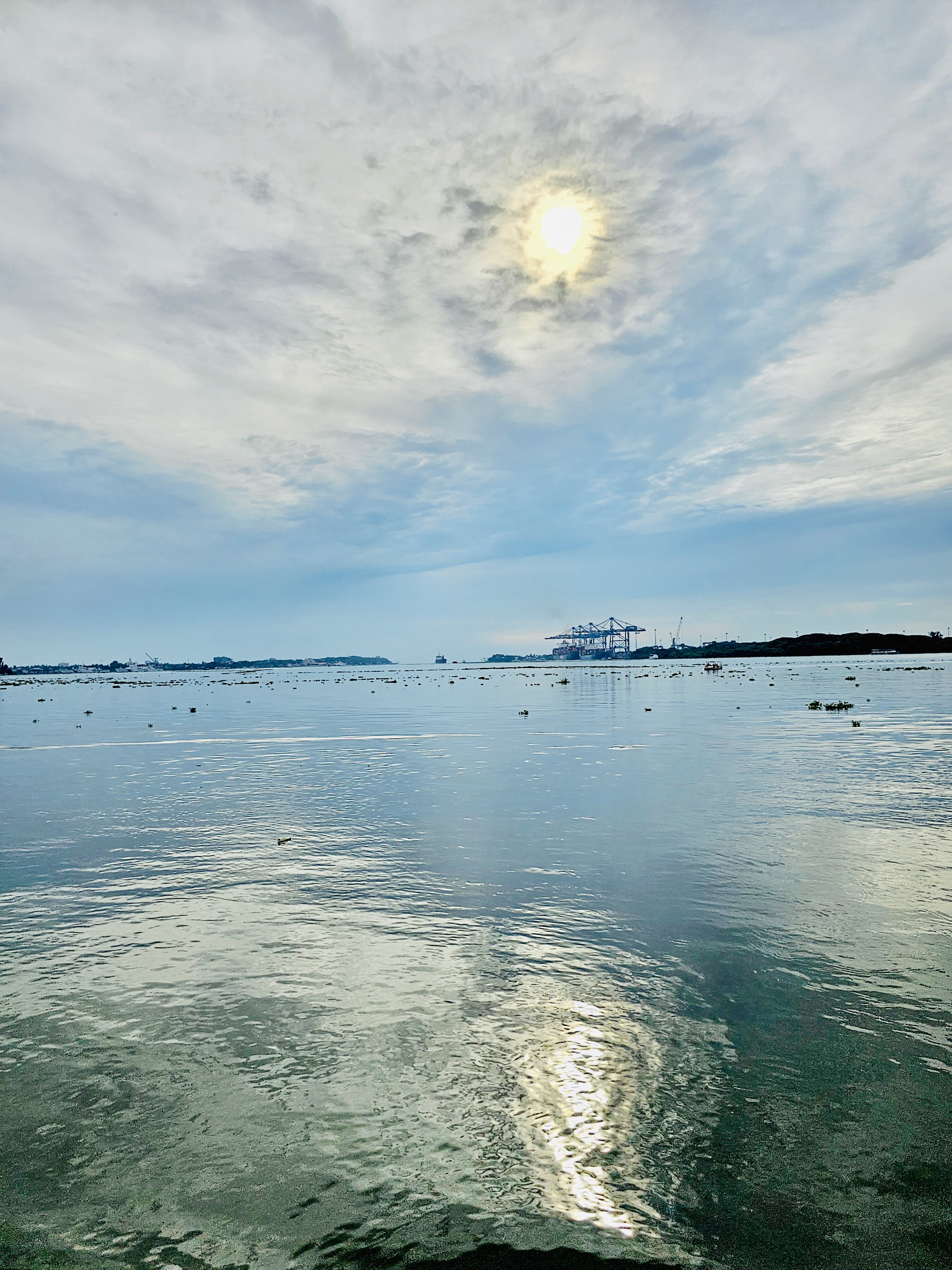 The sun & sea mouth. A long view of backwaters joining with sea. Also a pass way for ships to Cochin port. From Ernakulam, Kerala