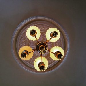 Light Bulbs aglow in a ceiling fixture
