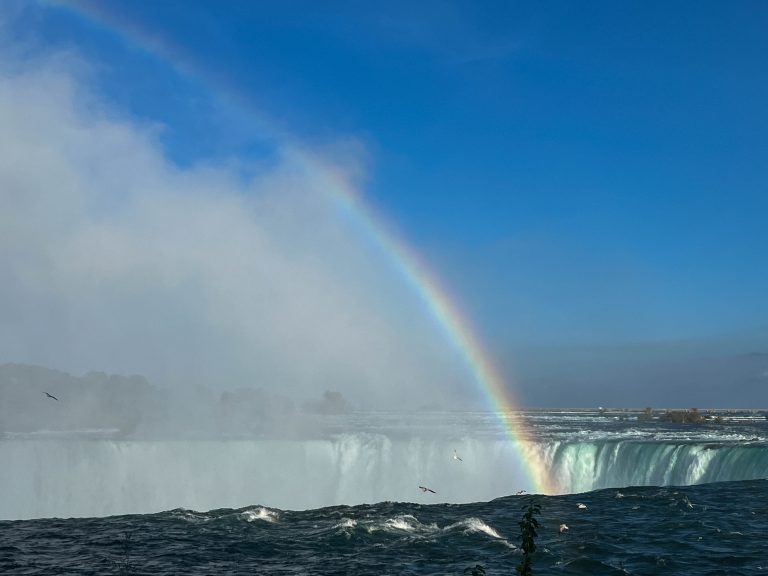 A rainbow in the mist over Horseshoe Falls of Niagara Falls