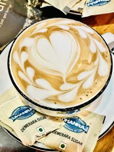 Cappuccino with sugar bags. From Kozhikode, Kerala.