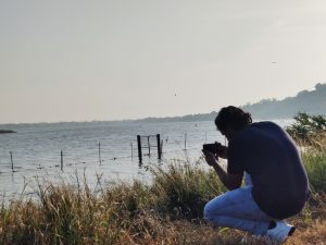 In this image, a photographer is capturing the nature in early morning at the bank of Lake in Bhopal City during OpenVerse walk.