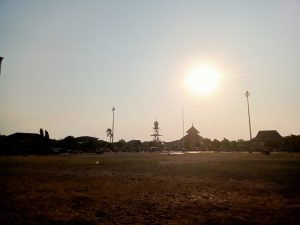 The Masjid Agung Mosque, also known as the Demak Great Mosque, in Indonesia, photographed in the afternoon, with the sun shining bright behind it. 
