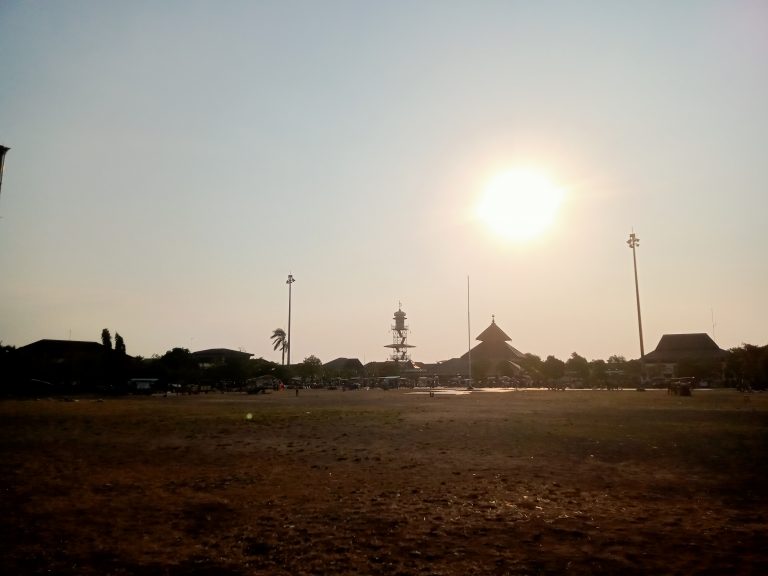 The Masjid Agung Mosque, also known as the Demak Great Mosque, in Indonesia, photographed in the afternoon, with the sun shining bright behind it.