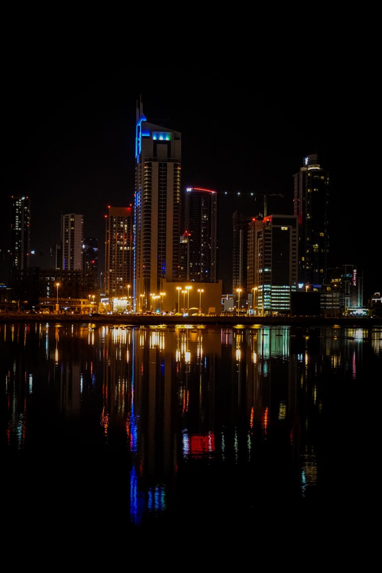 A snapshot of urban allure: Bahrain’s city lights twinkle against the night, blending tradition and progress in a captivating dance of architecture and innovation