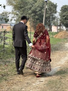 A newly wed couple walking with love and care
