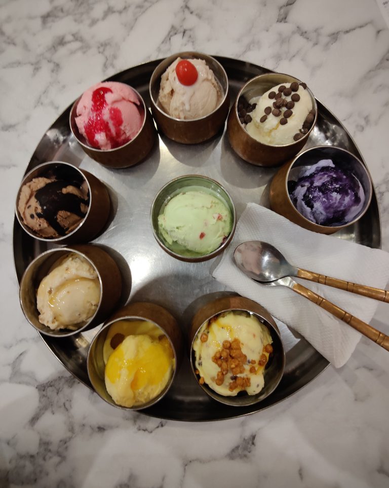 Collection of different kinds of Ice cream and it is called thali.