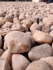 Close-up view of smooth, rounded pebbles or stones.
