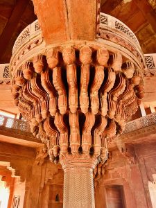 Grand 16th century red stone pillars, From Fatehpur Sikri complex, Uttar Pradesh, India.