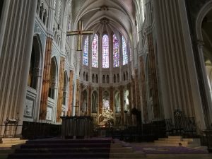 an inside view of an church “cathedral of chartres” show the altar and statues
