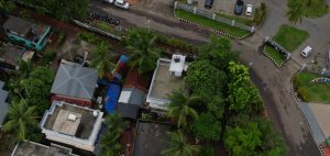 Aerial view of houses and trees on a road #WPPhotoFestival