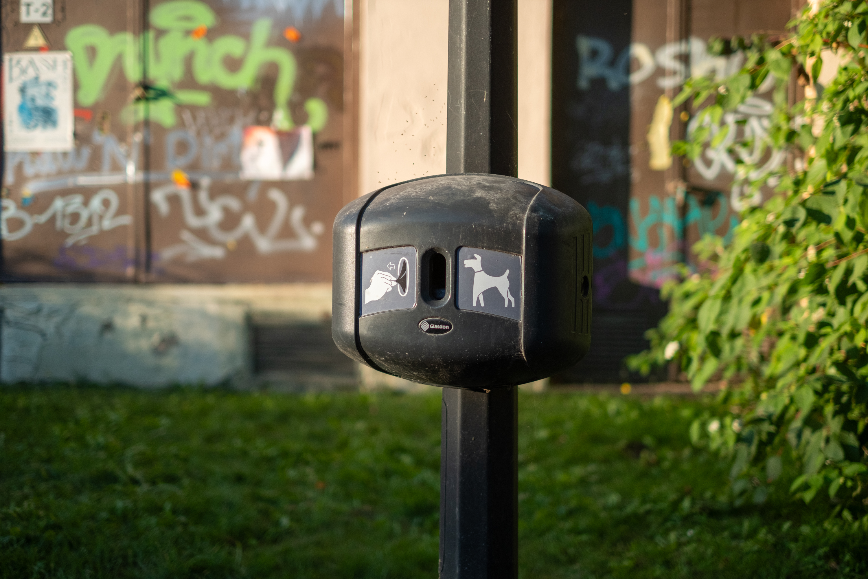 A closeup view of Dog bag dispenser in a park of Vilnius.