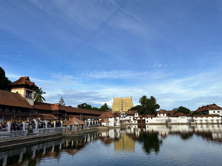 Sree Padmanabha Swamy Temple, Thiruvananthapuram, Kerala. World’s richest religious place with a treasure of over a trillion US dollars. The temple is reflected in the still water in the foreground.