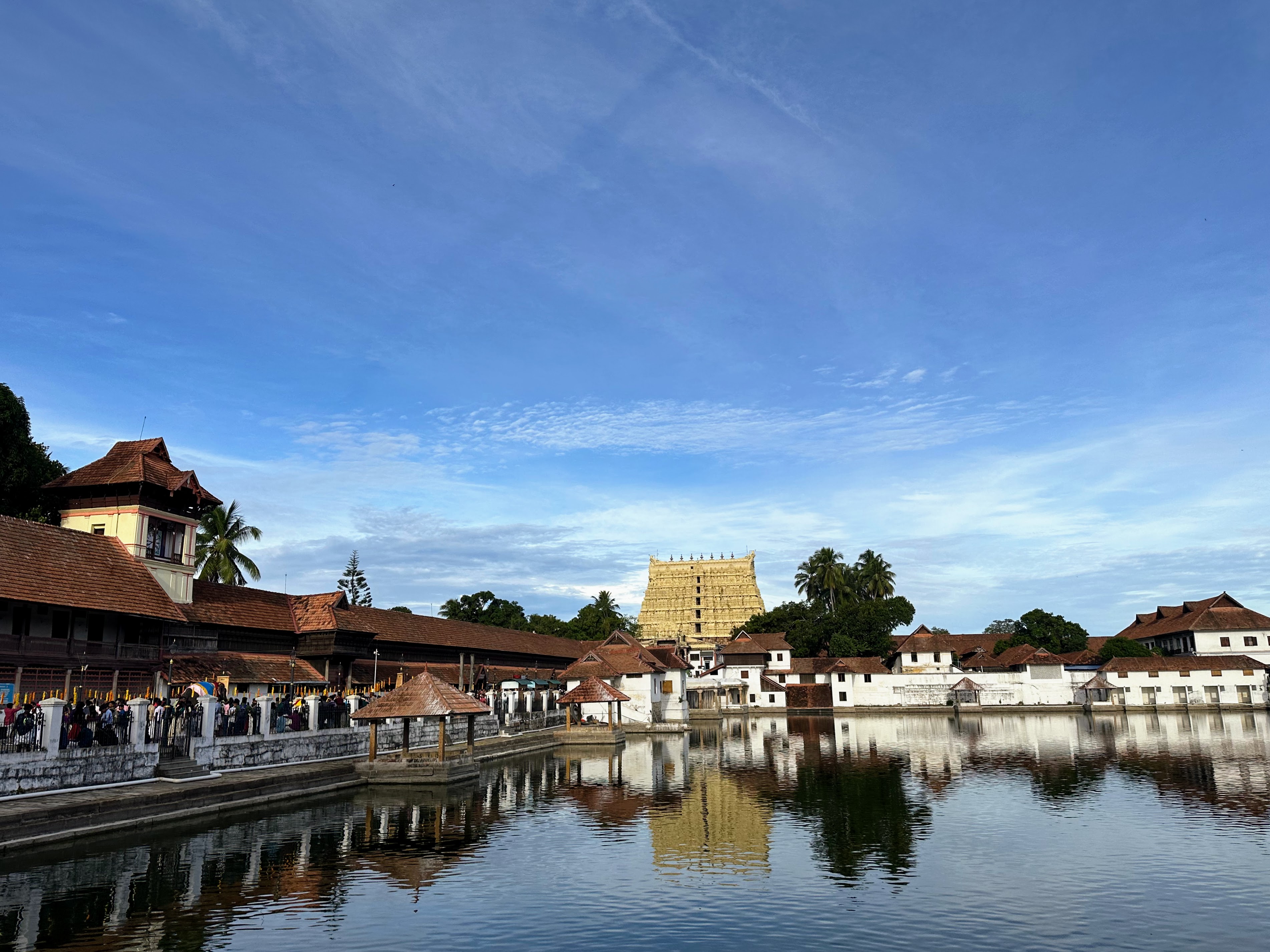 Sree Padmanabha Swamy Temple, Thiruvananthapuram, Kerala. World's richest religious place with a treasure of over a trillion US dollars. The temple is reflected in the still water in the foreground.