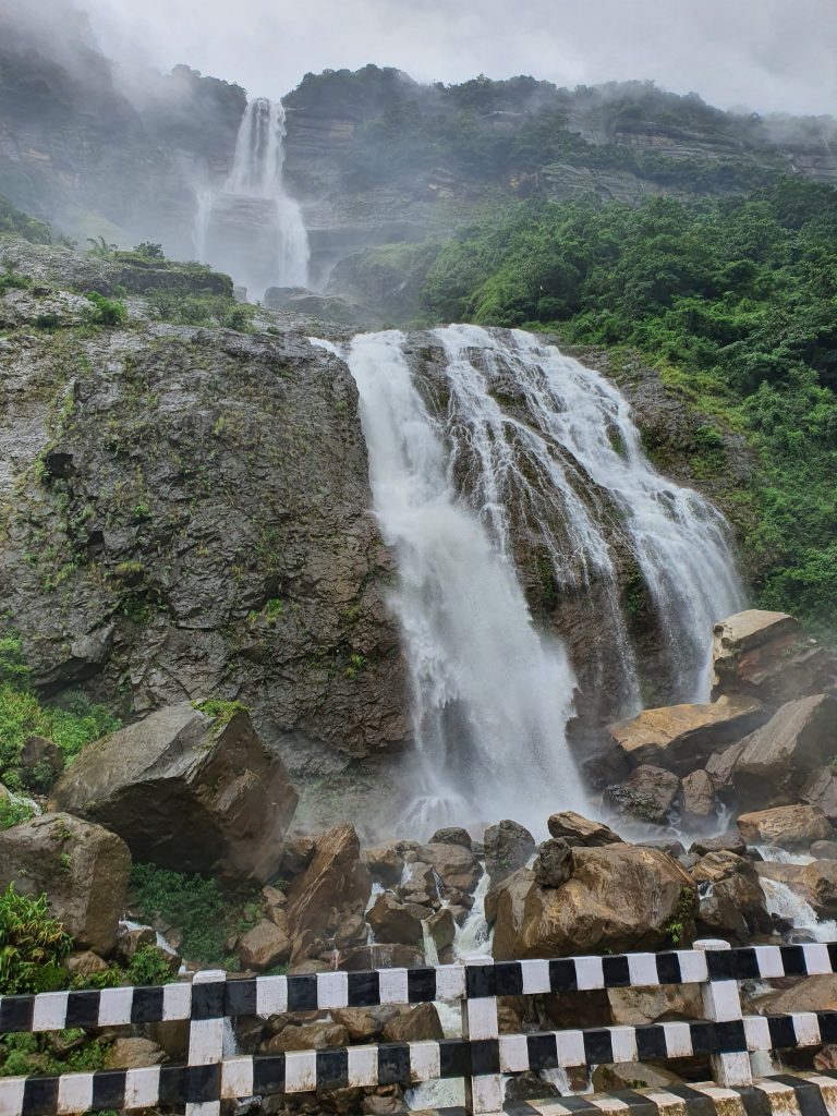 Beautiful water falls on the green hill