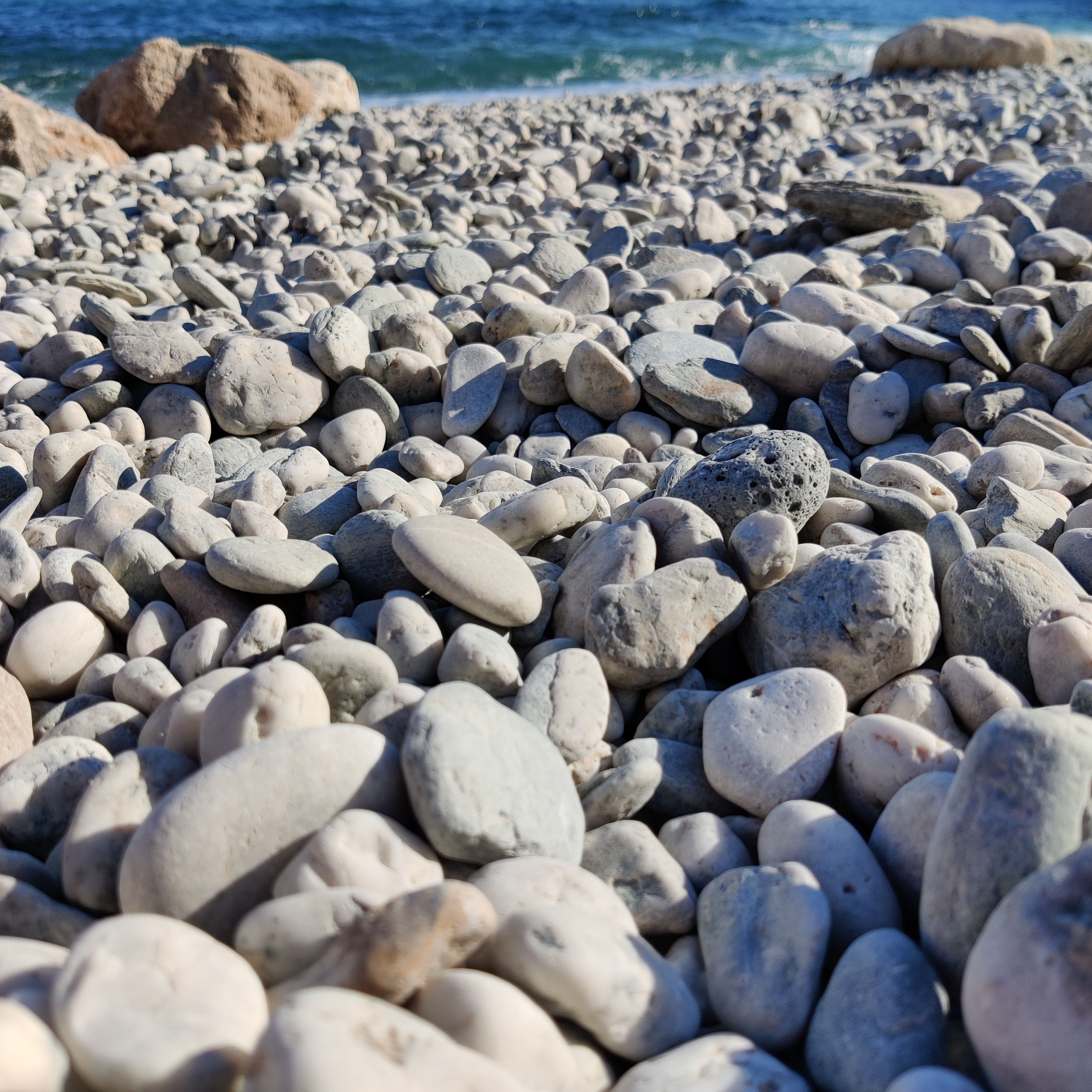 Plenty of rounded rocks on the beach