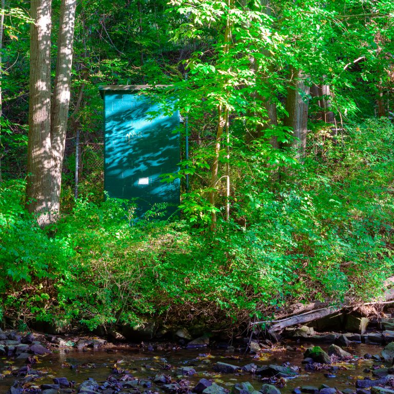 Cement monolith in the forest.