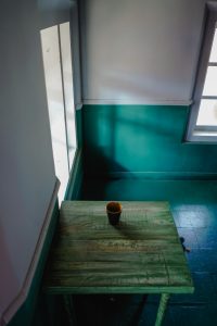 Vintage style room with wooden table and tea cup taken from kozhikode.