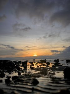 In frame is a beautiful sunset on the beach in guimaras island