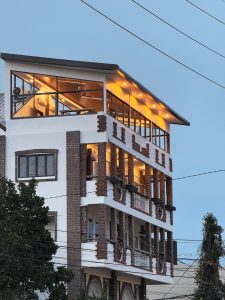 The building stands as a silhouette against the fading twilight at Iloilo City.