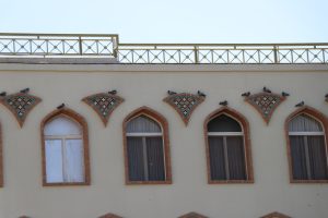 Pigeons perch on the windows of a hotel in isfahan, iran. The pigeons are a common sight in isfahan, and they are often seen perched on the rooftops and in the parks of the city.
