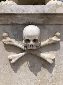 Skull on grave in cemetery of Lisbon
