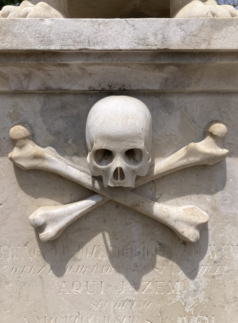 Skull on grave in cemetery of Lisbon